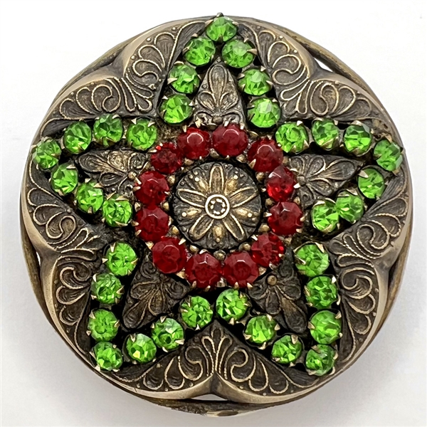Huge brass jewel button of a star with green and red pastes.