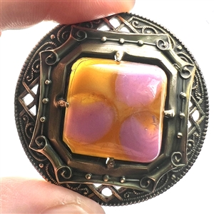 Gay 90's button with glass jewel center.