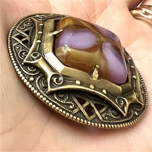 Gay 90's button with glass jewel center.