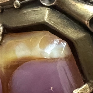 Gay 90's button with glass jewel center.
