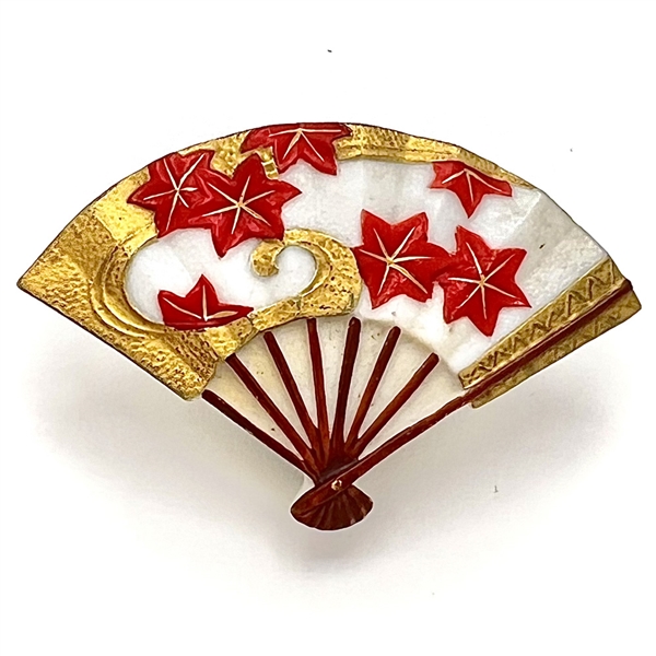 Japanese Arita porcelain button of a realistic fan decorated with maple leaves.
