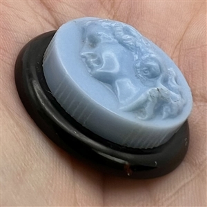 Vintage Colt rouge button ofa woman.