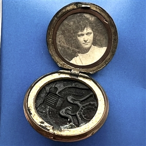Card with three US Army buttons including one as a locket with photo inside.