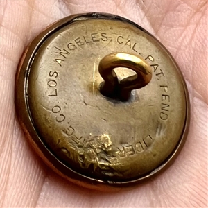 Card with three US Army buttons including one as a locket with photo inside.