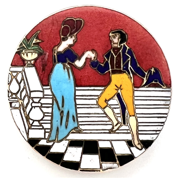 Champlevé enamel button of woman and man from the opera “Madame Sans Gene."