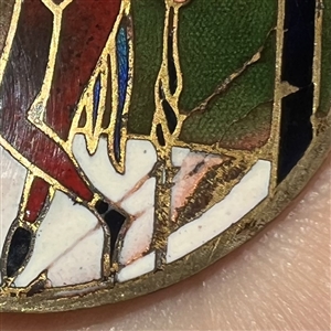 Champlevé enamel button of a Fop.