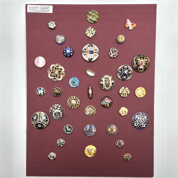 Card of 36 enamel buttons. 