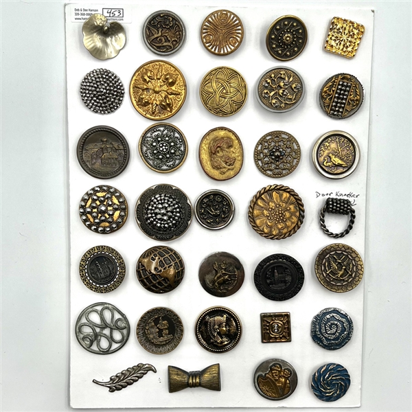 Card of 35 assorted pictorial metal buttons.
