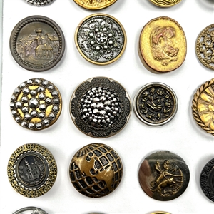Card of 35 assorted pictorial metal buttons.