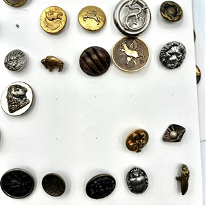 Two cards of 64 animal and other metal pictorial  buttons. 