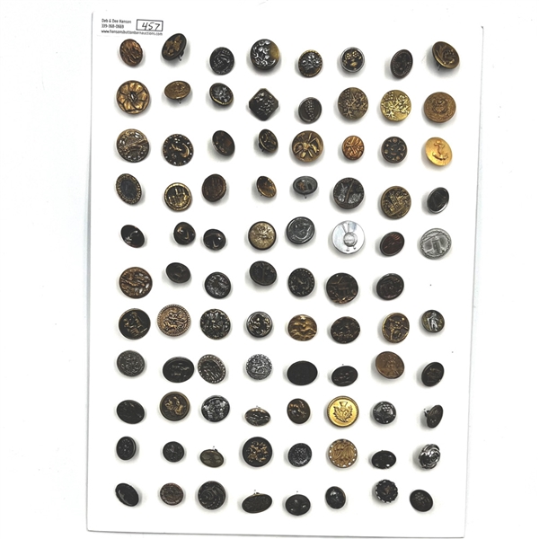 Card of 87 small metal picture buttons. 