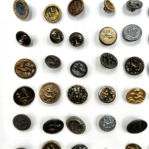Card of 87 small metal picture buttons. 