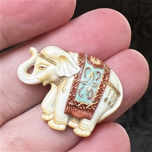 Arita porcelain button of a realistic Indian elephant.