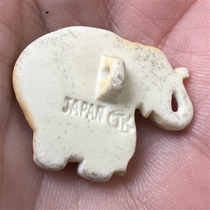 Arita porcelain button of a realistic Indian elephant.